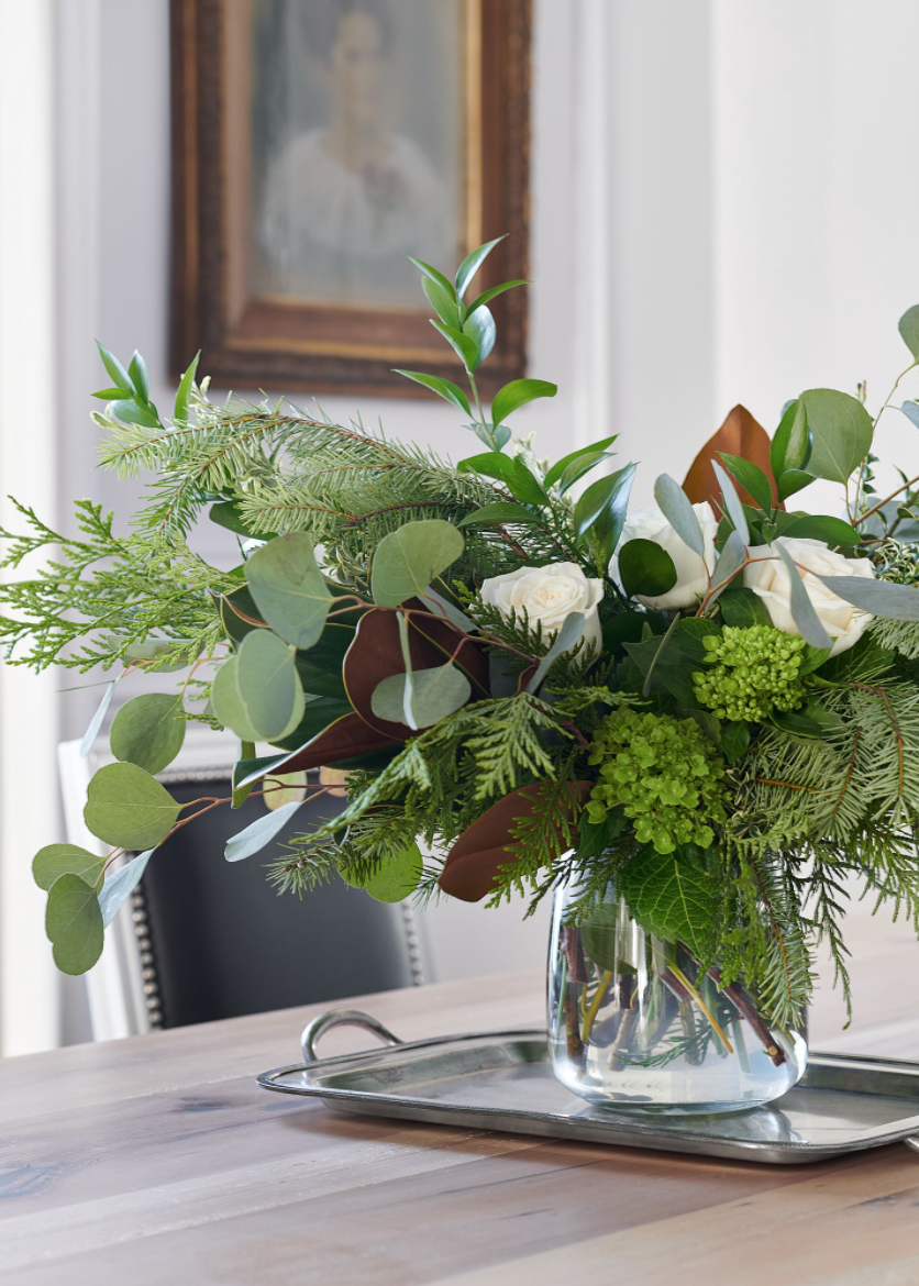 beautiful holiday flower arrangement on dining table