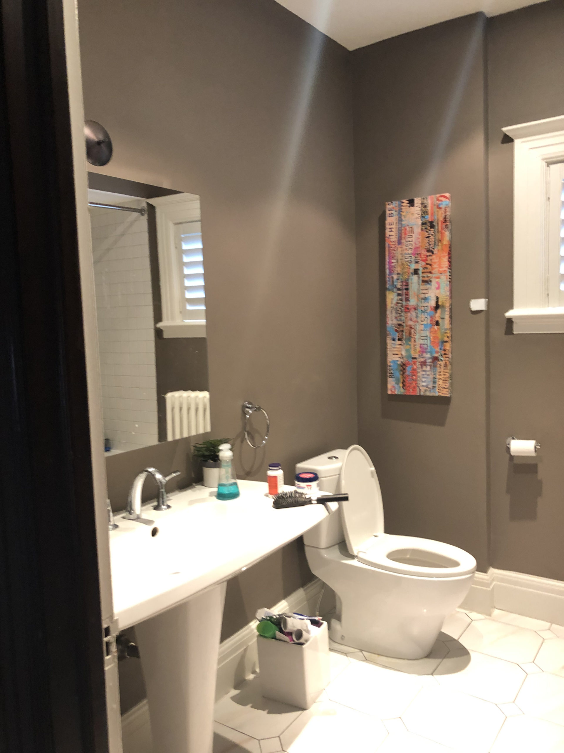 before photo of dark bathroom with sink and toilet
