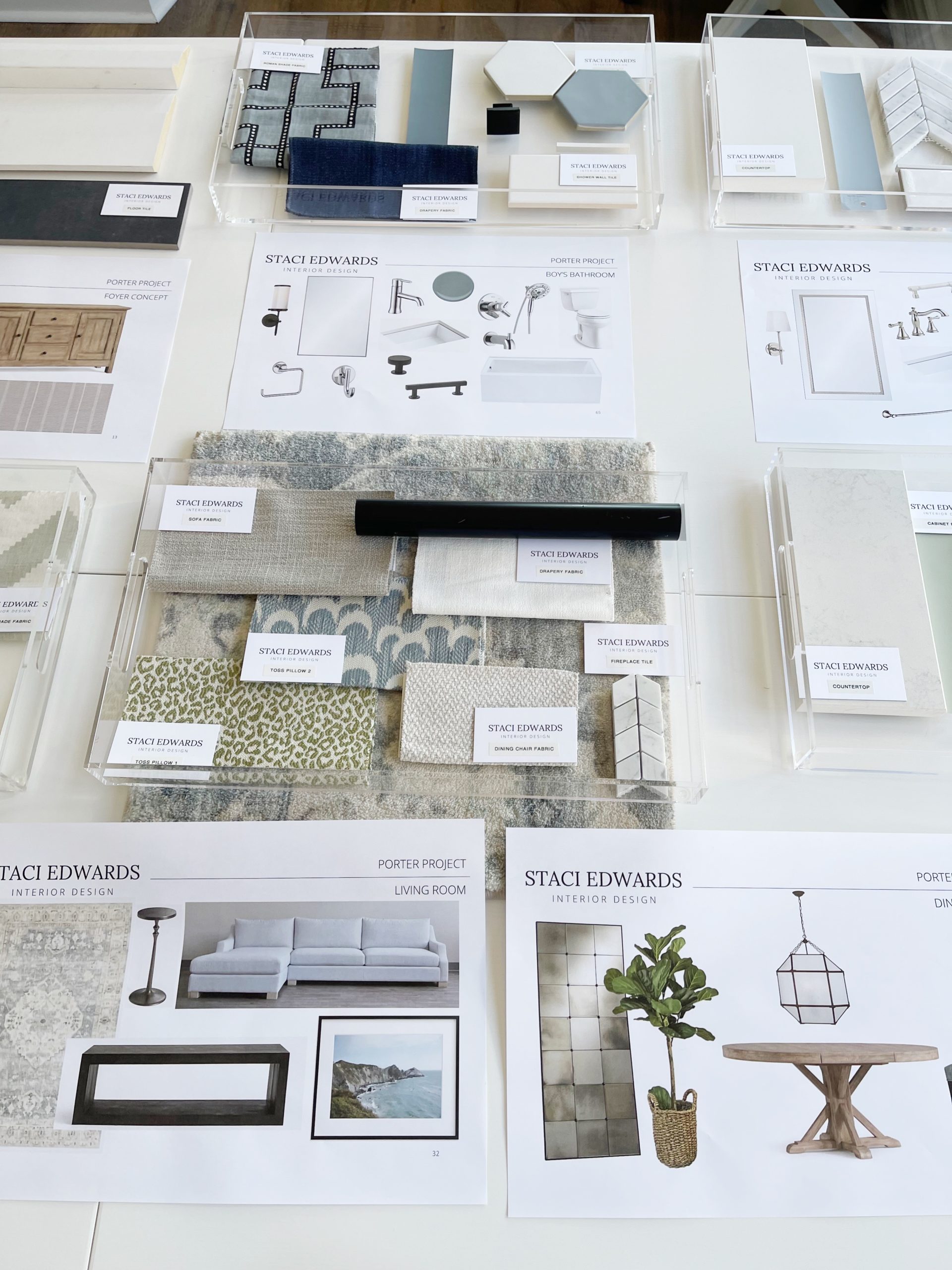 photo of design presentation with clear trays filled with fabric and finishes samples